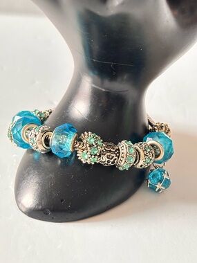 Pandora-style charm bracelet blue glass beads, silver and blue rhinestones.